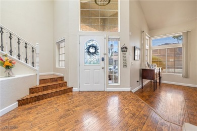 This stunning two-story residence offers 5 spacious bedrooms and on Painted Desert Golf Club in Nevada - for sale on GolfHomes.com, golf home, golf lot