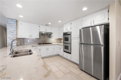 This stunning two-story residence offers 5 spacious bedrooms and on Painted Desert Golf Club in Nevada - for sale on GolfHomes.com, golf home, golf lot