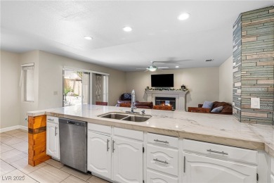 This stunning two-story residence offers 5 spacious bedrooms and on Painted Desert Golf Club in Nevada - for sale on GolfHomes.com, golf home, golf lot