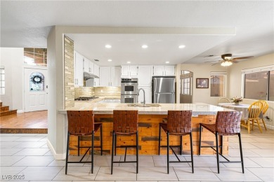 This stunning two-story residence offers 5 spacious bedrooms and on Painted Desert Golf Club in Nevada - for sale on GolfHomes.com, golf home, golf lot