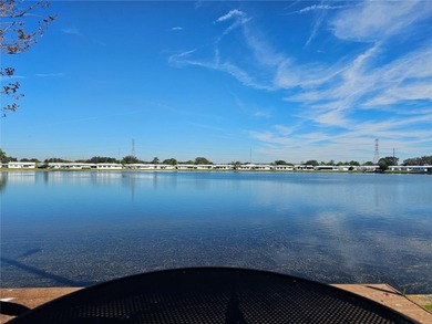 WATERFRONT LIVING IN STYLE... ENJOY YOUR NEW HOME IN THIS ACTIVE on Mainlands Golf Club in Florida - for sale on GolfHomes.com, golf home, golf lot