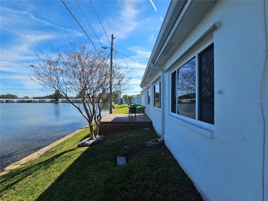 WATERFRONT LIVING IN STYLE... ENJOY YOUR NEW HOME IN THIS ACTIVE on Mainlands Golf Club in Florida - for sale on GolfHomes.com, golf home, golf lot
