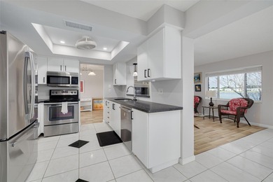 WATERFRONT LIVING IN STYLE... ENJOY YOUR NEW HOME IN THIS ACTIVE on Mainlands Golf Club in Florida - for sale on GolfHomes.com, golf home, golf lot