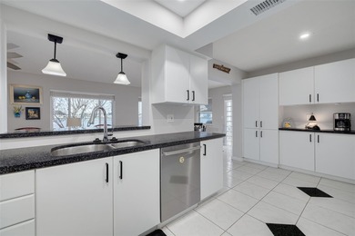 WATERFRONT LIVING IN STYLE... ENJOY YOUR NEW HOME IN THIS ACTIVE on Mainlands Golf Club in Florida - for sale on GolfHomes.com, golf home, golf lot