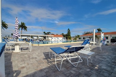 WATERFRONT LIVING IN STYLE... ENJOY YOUR NEW HOME IN THIS ACTIVE on Mainlands Golf Club in Florida - for sale on GolfHomes.com, golf home, golf lot