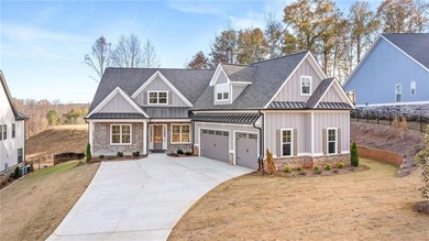 Located in the desirable Traditions of Braselton community on on Traditions of Braselton Golf Club in Georgia - for sale on GolfHomes.com, golf home, golf lot