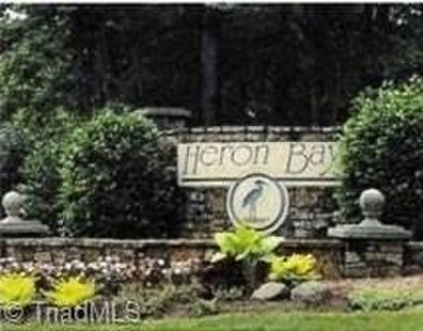 Beautiful building lot in Prestigious PRIVATE HERON BAY LAKE on Old North State Club at Uwharrie Point Golf community in North Carolina - for sale on GolfHomes.com, golf home, golf lot