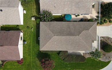 BOND PAID AND MOVE IN READY!  THIS DARLING COLONY PATIO VILLA on Roosevelt Executive Golf Course in Florida - for sale on GolfHomes.com, golf home, golf lot