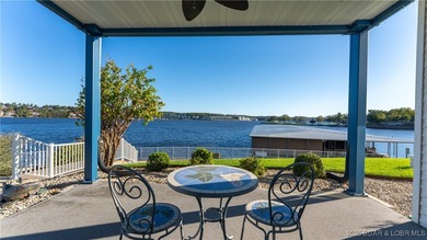 Enjoy incredible lake views from this spacious 4-bedroom, 3-bath on Tan-Tar-A Golf Club in Missouri - for sale on GolfHomes.com, golf home, golf lot