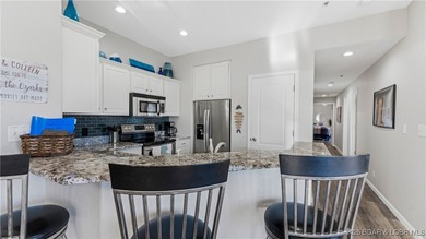 Enjoy incredible lake views from this spacious 4-bedroom, 3-bath on Tan-Tar-A Golf Club in Missouri - for sale on GolfHomes.com, golf home, golf lot