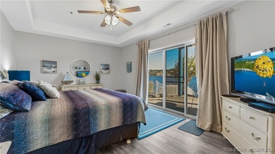 Enjoy incredible lake views from this spacious 4-bedroom, 3-bath on Tan-Tar-A Golf Club in Missouri - for sale on GolfHomes.com, golf home, golf lot