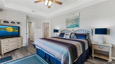 Enjoy incredible lake views from this spacious 4-bedroom, 3-bath on Tan-Tar-A Golf Club in Missouri - for sale on GolfHomes.com, golf home, golf lot