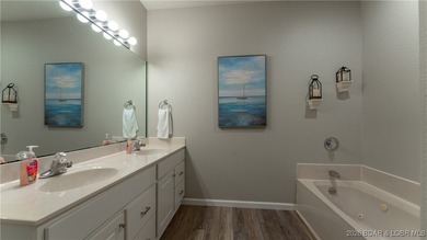 Enjoy incredible lake views from this spacious 4-bedroom, 3-bath on Tan-Tar-A Golf Club in Missouri - for sale on GolfHomes.com, golf home, golf lot