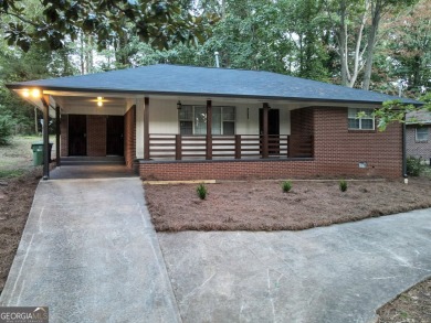 Welcome to your stunning and amazingly renovated home, nestled on Alfred Tup Holmes Golf Course in Georgia - for sale on GolfHomes.com, golf home, golf lot