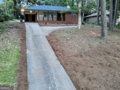 Welcome to your stunning and amazingly renovated home, nestled on Alfred Tup Holmes Golf Course in Georgia - for sale on GolfHomes.com, golf home, golf lot