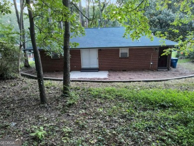 Welcome to your stunning and amazingly renovated home, nestled on Alfred Tup Holmes Golf Course in Georgia - for sale on GolfHomes.com, golf home, golf lot