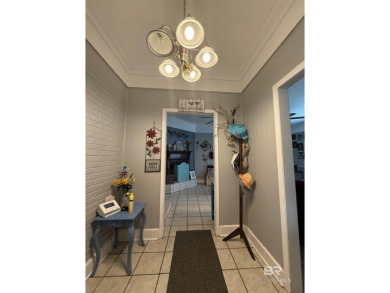Charming 3-bedroom, 2-bath home conveniently located in town on Vanity Fair Golf and Tennis Club in Alabama - for sale on GolfHomes.com, golf home, golf lot