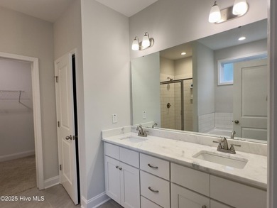 This stunning new 4-bedroom, 2.5-bath home in the gated Woodlake on Woodlake Country Club in North Carolina - for sale on GolfHomes.com, golf home, golf lot