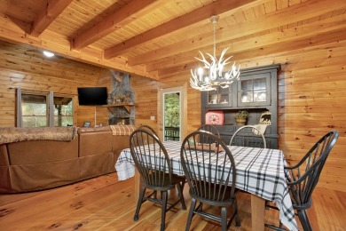 Nature abounds at this furnished cabin nestled on the banks of on White Path Golf Club in Georgia - for sale on GolfHomes.com, golf home, golf lot