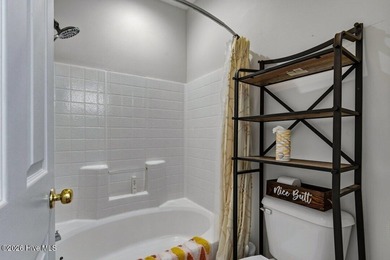 Updated and renovated, 2 bedroom, 2 bathroom, second floor, end on Sandpiper Bay Golf and Country Club in North Carolina - for sale on GolfHomes.com, golf home, golf lot