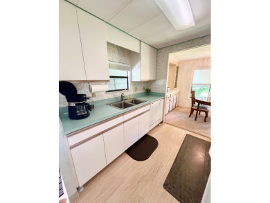 This beautiful two-bedroom, two-bath home is located in the on Pine Lakes Country Club in Florida - for sale on GolfHomes.com, golf home, golf lot