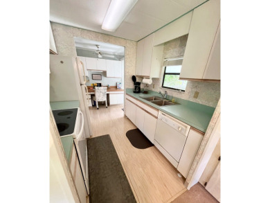 This beautiful two-bedroom, two-bath home is located in the on Pine Lakes Country Club in Florida - for sale on GolfHomes.com, golf home, golf lot