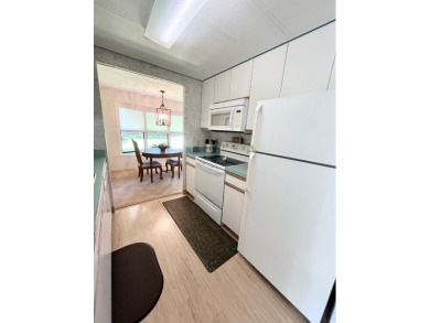 This beautiful two-bedroom, two-bath home is located in the on Pine Lakes Country Club in Florida - for sale on GolfHomes.com, golf home, golf lot