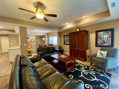 Experience easy lake living in this spacious two-story condo at on Tan-Tar-A Golf Club in Missouri - for sale on GolfHomes.com, golf home, golf lot