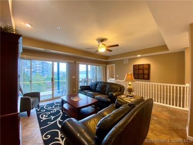 Experience easy lake living in this spacious two-story condo at on Tan-Tar-A Golf Club in Missouri - for sale on GolfHomes.com, golf home, golf lot