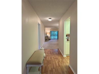2 BR/2 BA, 1224 sq. ft. 2nd Floor Condo with Assigned Covered on Tarpon Woods Golf Club in Florida - for sale on GolfHomes.com, golf home, golf lot