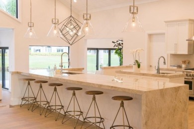 Welcome to 910 Greensward Ln, a stunning contemporary on Seagate Country Club in Florida - for sale on GolfHomes.com, golf home, golf lot
