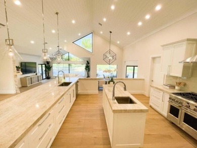 Welcome to 910 Greensward Ln, a stunning contemporary on Seagate Country Club in Florida - for sale on GolfHomes.com, golf home, golf lot