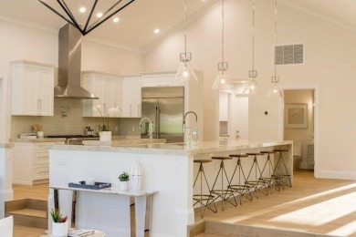 Welcome to 910 Greensward Ln, a stunning contemporary on Seagate Country Club in Florida - for sale on GolfHomes.com, golf home, golf lot