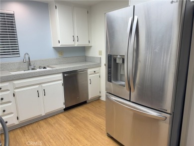 Nestled on a peaceful street, this inviting lower-level 'La on Leisure Village Par 3 Golf Course in California - for sale on GolfHomes.com, golf home, golf lot