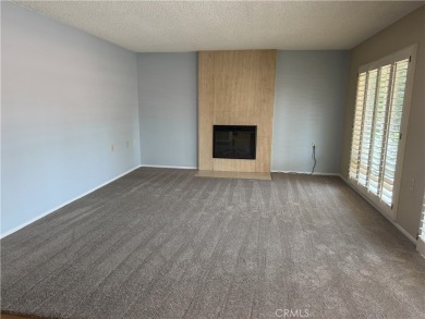 Nestled on a peaceful street, this inviting lower-level 'La on Leisure Village Par 3 Golf Course in California - for sale on GolfHomes.com, golf home, golf lot