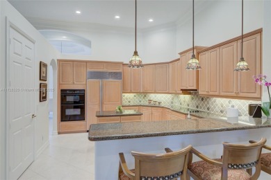 Discover this exquisite 4-bed 3.5-bath w/office & den pool home on Weston Hills Country Club in Florida - for sale on GolfHomes.com, golf home, golf lot