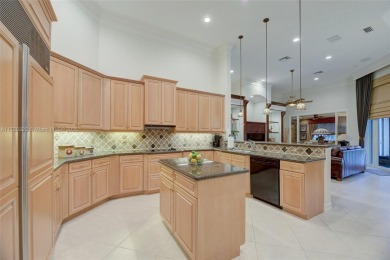 Discover this exquisite 4-bed 3.5-bath w/office & den pool home on Weston Hills Country Club in Florida - for sale on GolfHomes.com, golf home, golf lot