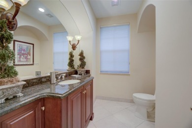 Discover this exquisite 4-bed 3.5-bath w/office & den pool home on Weston Hills Country Club in Florida - for sale on GolfHomes.com, golf home, golf lot