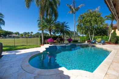 Discover this exquisite 4-bed 3.5-bath w/office & den pool home on Weston Hills Country Club in Florida - for sale on GolfHomes.com, golf home, golf lot