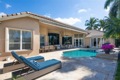 Discover this exquisite 4-bed 3.5-bath w/office & den pool home on Weston Hills Country Club in Florida - for sale on GolfHomes.com, golf home, golf lot