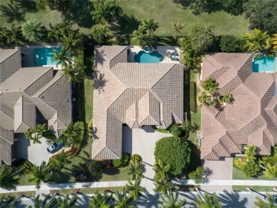 Discover this exquisite 4-bed 3.5-bath w/office & den pool home on Weston Hills Country Club in Florida - for sale on GolfHomes.com, golf home, golf lot