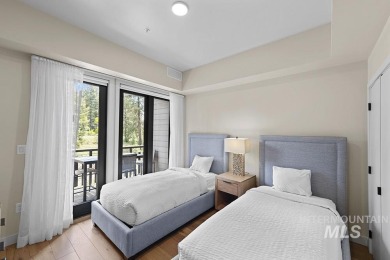 Discover luxury living in this exquisite 2-bedroom, 2-bathroom on Osprey Meadows at Tamarack Resort in Idaho - for sale on GolfHomes.com, golf home, golf lot