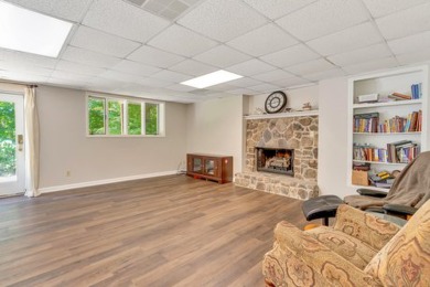 Upon entry, you're greeted by updated marble LVT flooring on Nob North Golf Course in Georgia - for sale on GolfHomes.com, golf home, golf lot