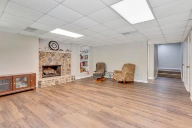 Upon entry, you're greeted by updated marble LVT flooring on Nob North Golf Course in Georgia - for sale on GolfHomes.com, golf home, golf lot