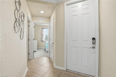 This rarely available second-floor end unit in Bonita National on Bonita National Golf Course in Florida - for sale on GolfHomes.com, golf home, golf lot