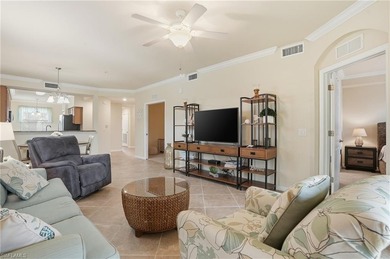 This rarely available second-floor end unit in Bonita National on Bonita National Golf Course in Florida - for sale on GolfHomes.com, golf home, golf lot