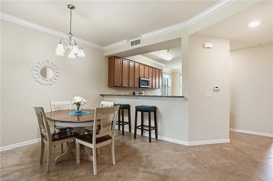 This rarely available second-floor end unit in Bonita National on Bonita National Golf Course in Florida - for sale on GolfHomes.com, golf home, golf lot