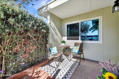 Beautifully updated patio-style townhouse offering modern on PalmBrook Country Club in Arizona - for sale on GolfHomes.com, golf home, golf lot