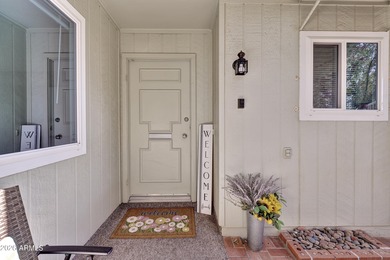 Beautifully updated patio-style townhouse offering modern on PalmBrook Country Club in Arizona - for sale on GolfHomes.com, golf home, golf lot