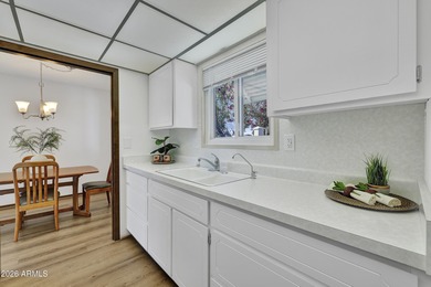 Beautifully updated patio-style townhouse offering modern on PalmBrook Country Club in Arizona - for sale on GolfHomes.com, golf home, golf lot